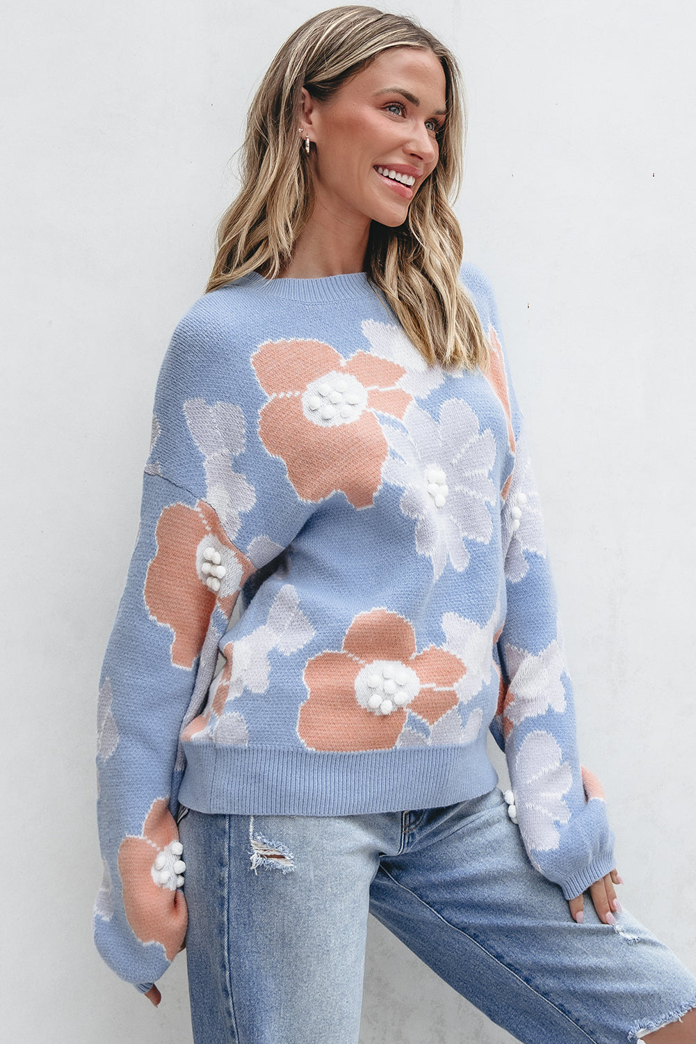 Blanche - Blue knitted jumper with a round neckline and floral pattern with dropped shoulders