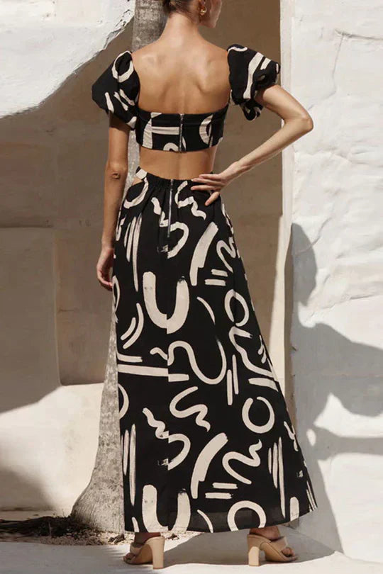 Matching set with printed off-shoulder top and maxi skirt with cutouts and pockets, perfect for a cool and fashionable summer look