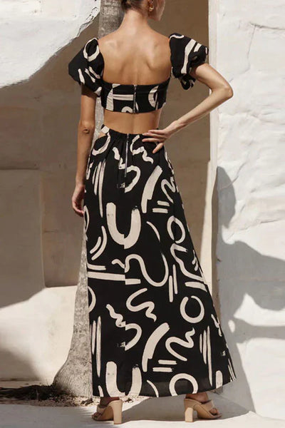Matching set with printed off-shoulder top and maxi skirt with cutouts and pockets, perfect for a cool and fashionable summer look