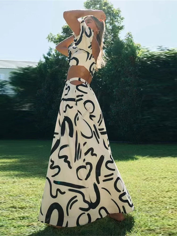 Matching set with printed off-shoulder top and maxi skirt with cutouts and pockets, perfect for a cool and fashionable summer look