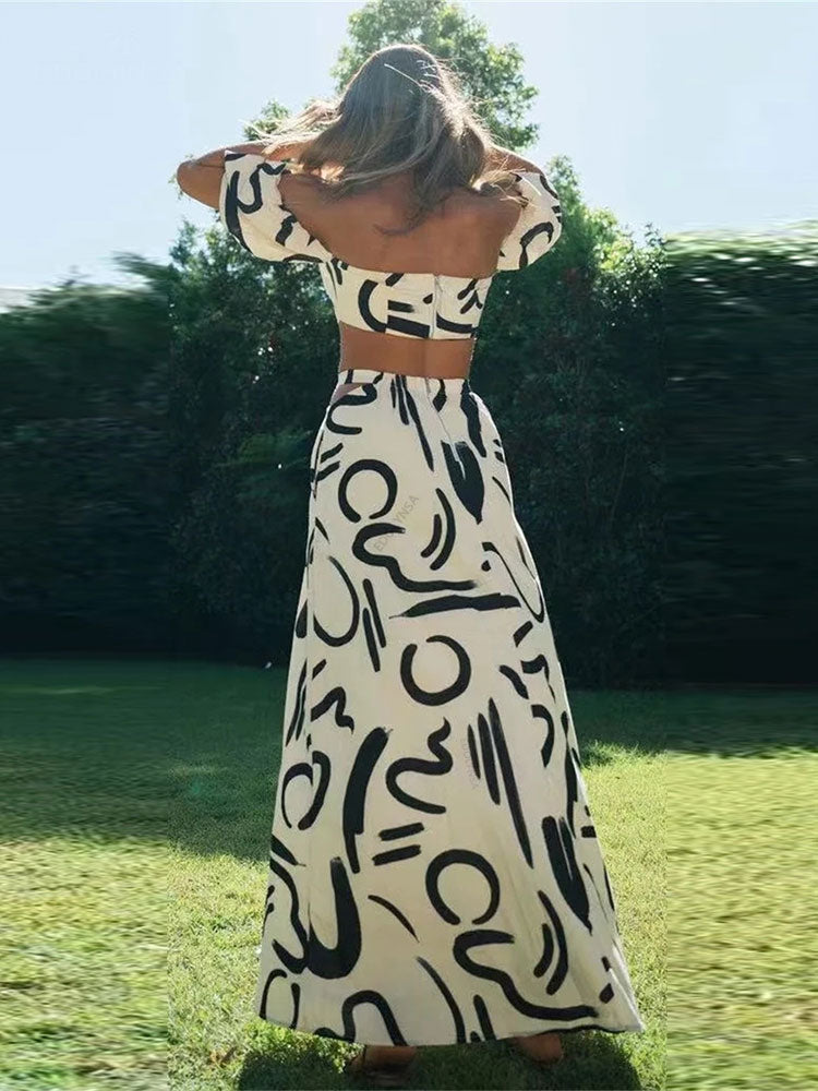 Matching set with printed off-shoulder top and maxi skirt with cutouts and pockets, perfect for a cool and fashionable summer look