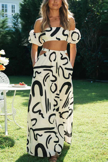 Matching set with printed off-shoulder top and maxi skirt with cutouts and pockets, perfect for a cool and fashionable summer look