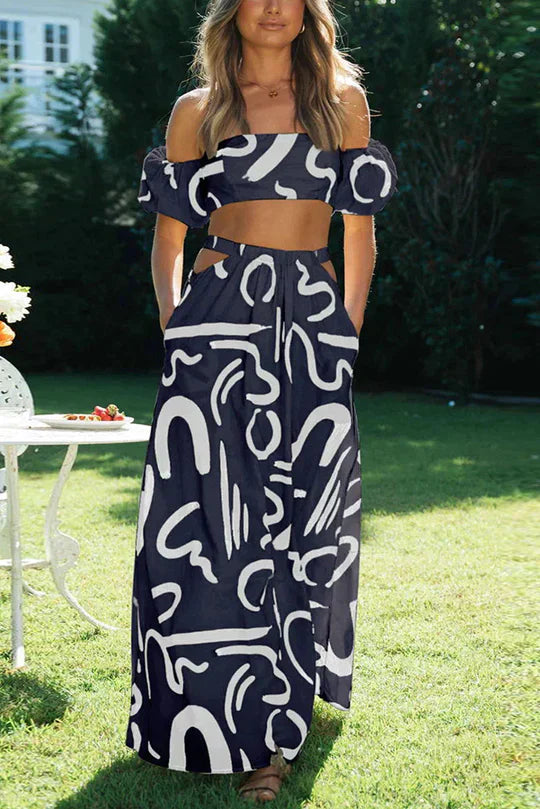 Matching set with printed off-shoulder top and maxi skirt with cutouts and pockets, perfect for a cool and fashionable summer look