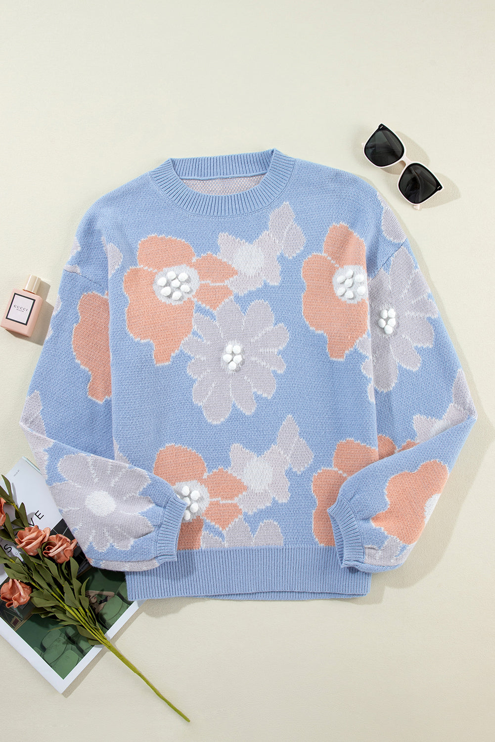 Blanche - Blue knitted jumper with a round neckline and floral pattern with dropped shoulders