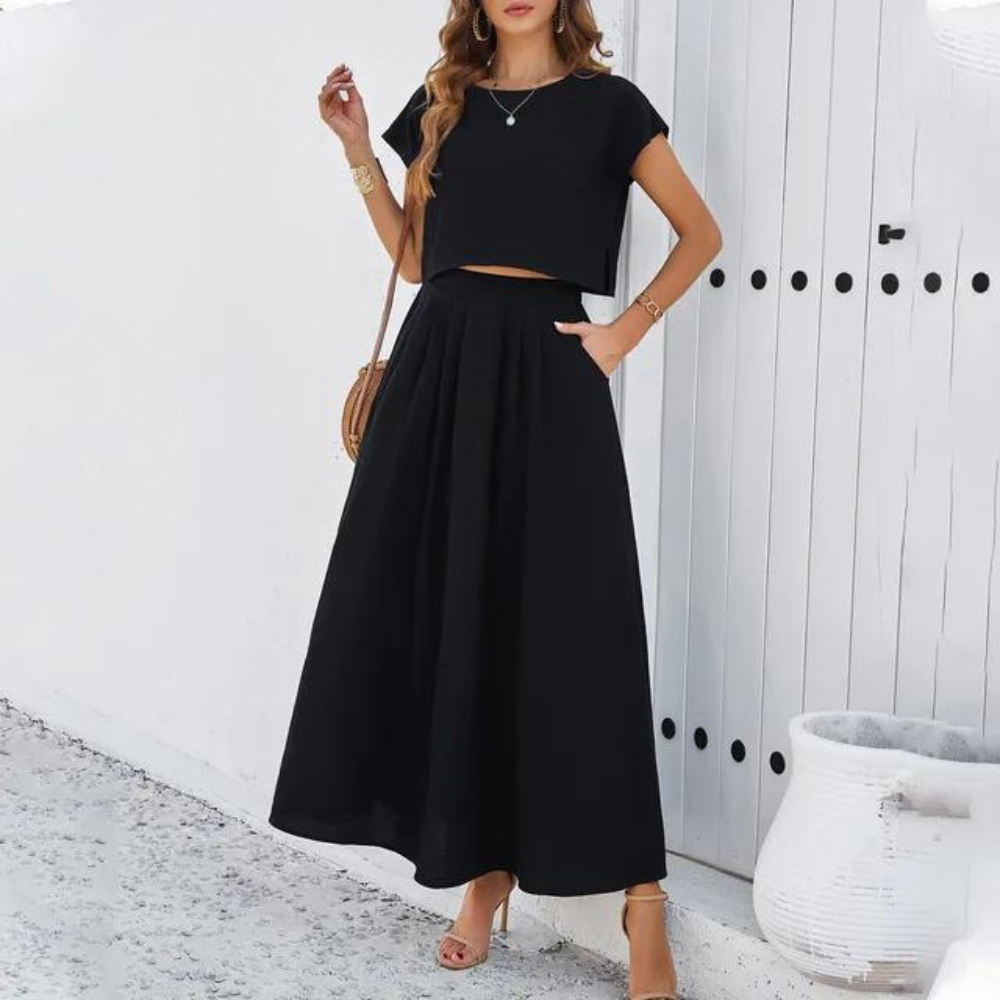 Elegant outfit with crop top and long flowing skirt, perfect for a refined and modern look ideal for special evenings