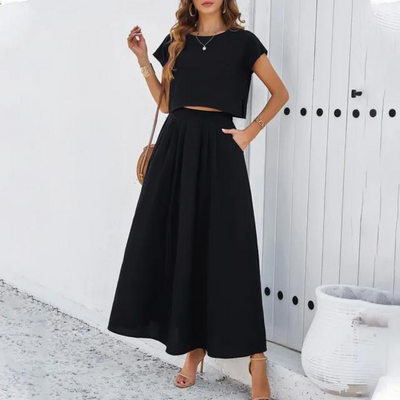 Elegant outfit with crop top and long flowing skirt, perfect for a refined and modern look ideal for special evenings