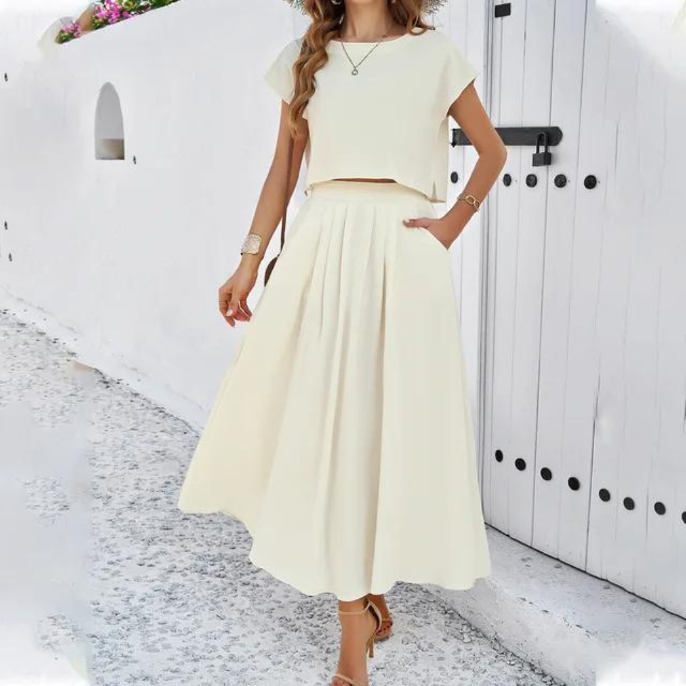 Elegant outfit with crop top and long flowing skirt, perfect for a refined and modern look ideal for special evenings
