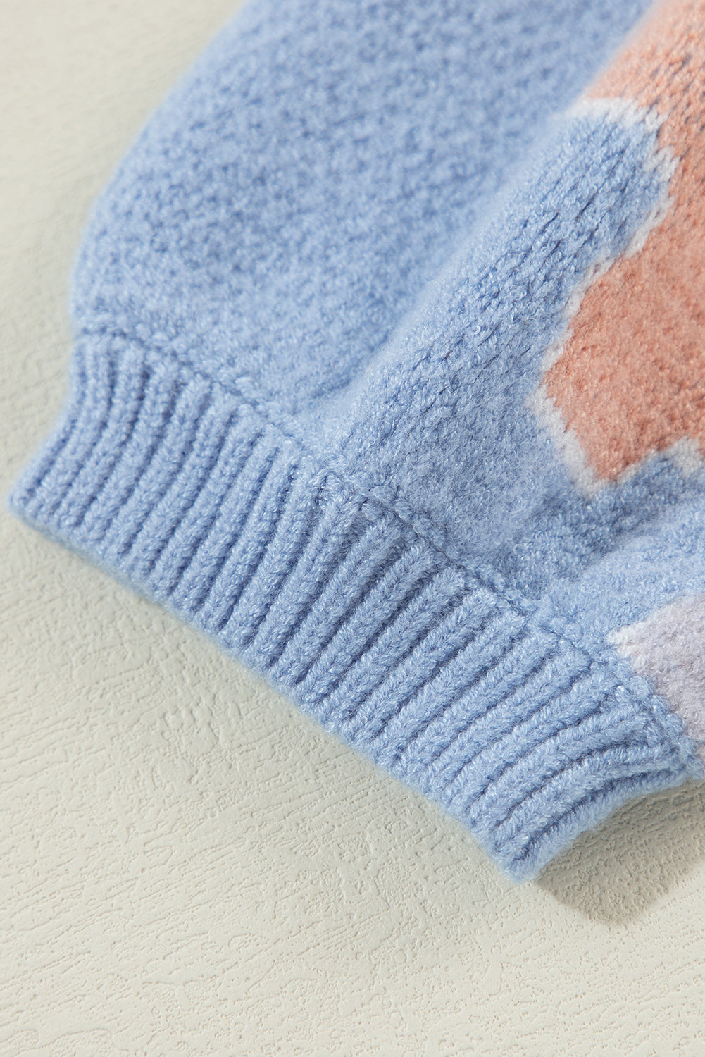 Blanche - Blue knitted jumper with a round neckline and floral pattern with dropped shoulders