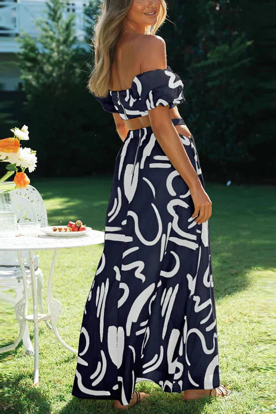 Matching set with printed off-shoulder top and maxi skirt with cutouts and pockets, perfect for a cool and fashionable summer look