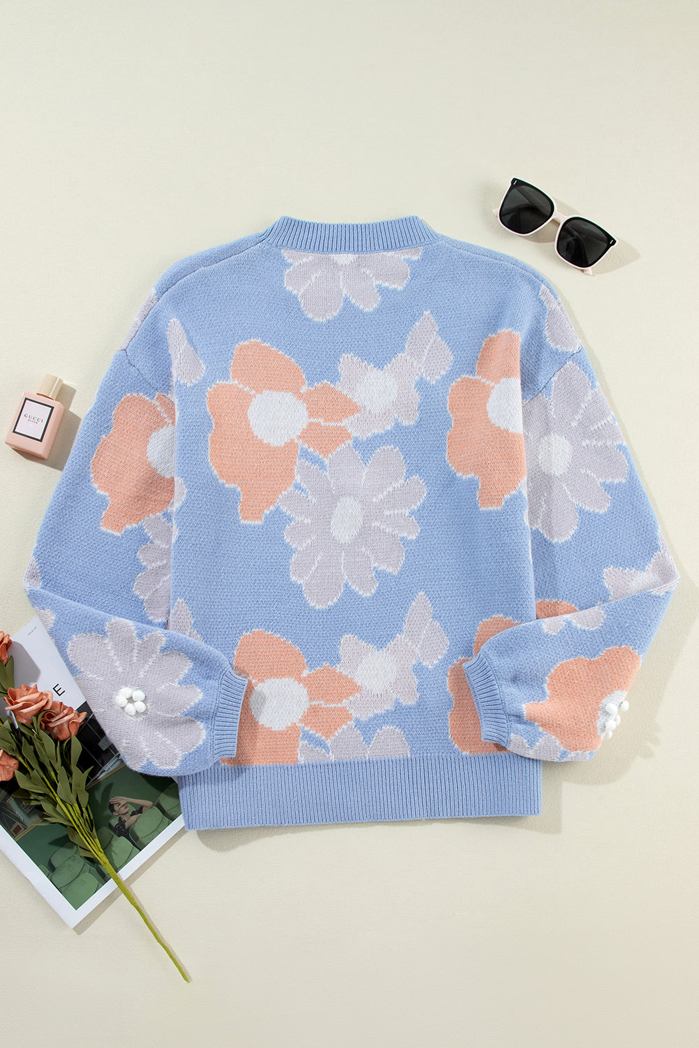 Blanche - Blue knitted jumper with a round neckline and floral pattern with dropped shoulders