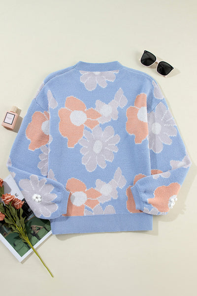 Blanche - Blue knitted jumper with a round neckline and floral pattern with dropped shoulders