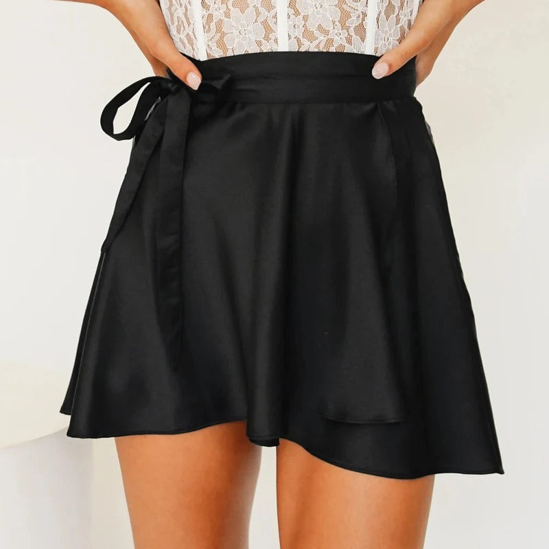 Elegant and feminine high-waisted satin wrap-around skirt, perfect for refined looks and special evenings